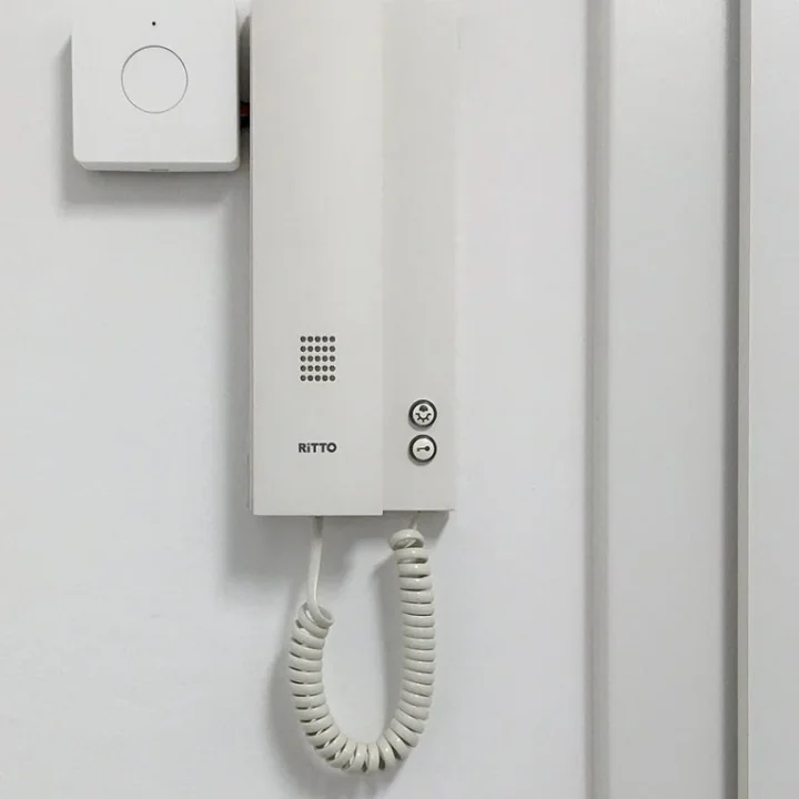 Home intercom with a Nuki Opener device installed above it.